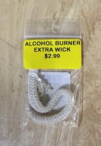 Alcohol burner wick packaged with price label.