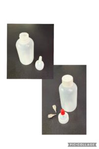 Two plastic squeeze bottles with caps and dropper tips on a dark background.