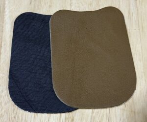 Two rectangular fabric pads, one dark blue and one brown, with rounded corners.