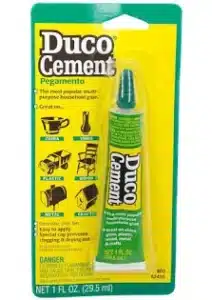 Duco Cement glue tube in yellow and green packaging.