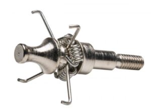 Close-up of a metal mechanical component with springs and hooks.