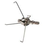 Compact camping stove burner with foldable legs and control valve.