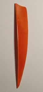 Close-up of an orange feather against a plain background.