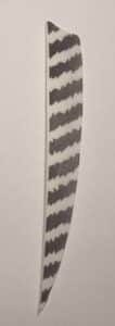 Close-up of a patterned blade with a wavy design.