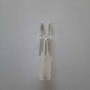 A pair of white plastic tongs on a gray surface.