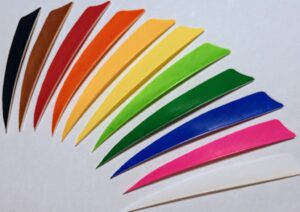 Colorful plastic picks arranged in a rainbow pattern.