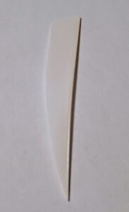 Close-up of a single, thin hair strand on a white background.