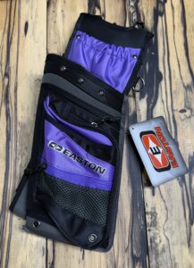 A purple and black cycling pouch with a small red and white bike light.