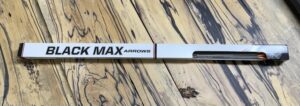 A Max Arrows branded box on a wooden floor.