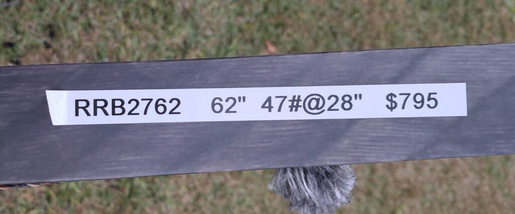 A metal bar labeled with specifications including length and weight.
