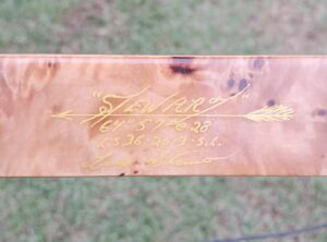 Close-up of a vintage fishing rod with the brand name 'Spencer'.