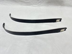 Two black windshield wiper blades placed on a white surface.