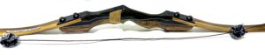 Antique wooden bow with leather quiver and arrow.