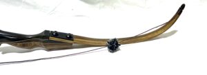 Traditional wooden bow with a decorative grip and string.