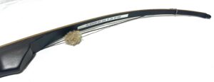 Close-up of a hockey stick blade with a wrapped knob end.
