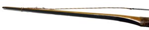 A traditional wooden archery bow with a twisted string.