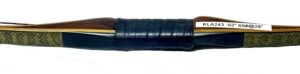 A close-up of a hockey stick handle wrapped in black tape.