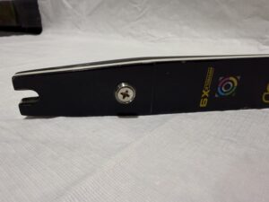 A close-up of a black guitar strap with a star decoration and logo.