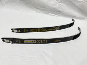 Two black archery limbs with yellow and white branding details.
