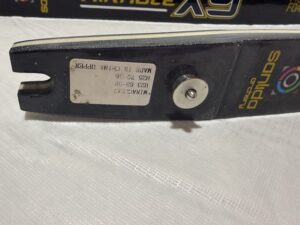 Close-up of a ski binding with a label showing DIN settings.