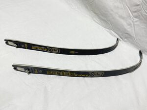Two black belts with gold embroidery on white fabric.
