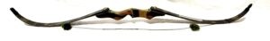 A modern recurve bow with a wooden riser and black limbs.